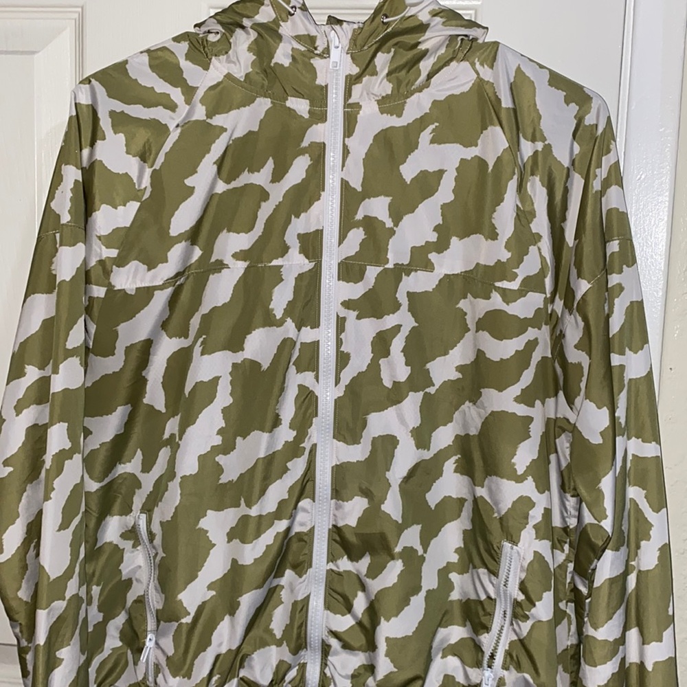 Green and white windbreaker